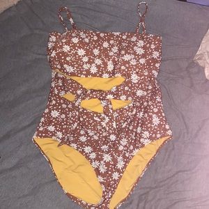 from aerie; a brown one piece bathing suit with flower details